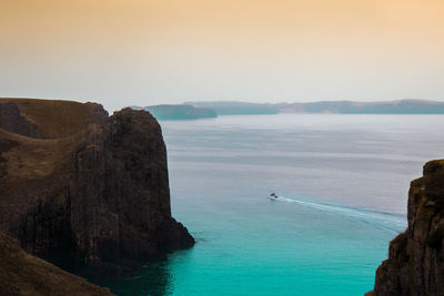 Scenic view of sea against clear sky