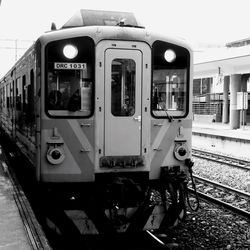 Train at railroad station against sky