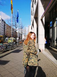 Woman with umbrella in city