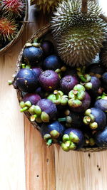 High angle view of grapes on wooden table