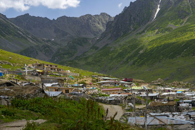 Aerial view of townscape by mountains