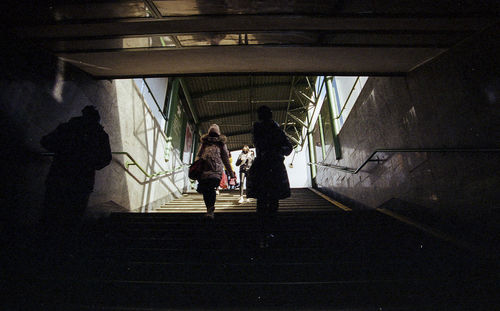 People standing in corridor of building