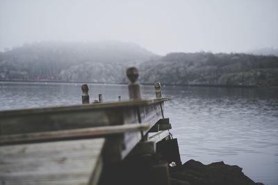 Pier over lake against sky