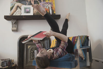 Transgender person reading upside down