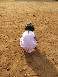 High angle view of girl on sand