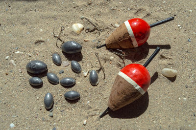 High angle view of cherries on sand