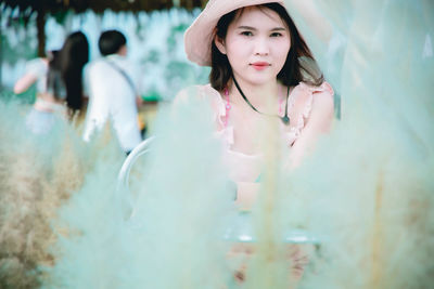 Portrait of beautiful young woman standing outdoors