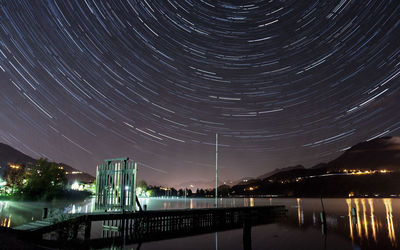 Light trails against sky at night