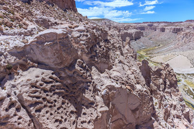 Rock formation on land against sky