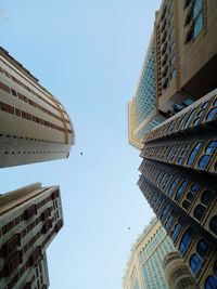 Low angle view of buildings against clear sky