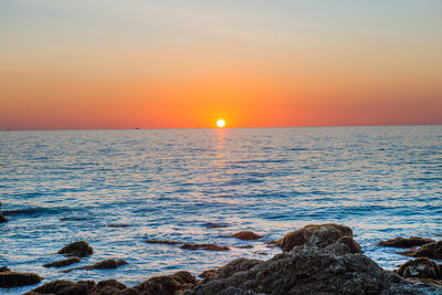 Scenic view of sea against sky during sunset