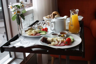 High angle view of breakfast on tray by window at home