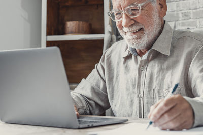 Man using laptop at table