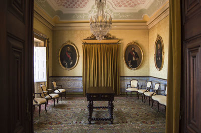 Empty chairs and tables in building