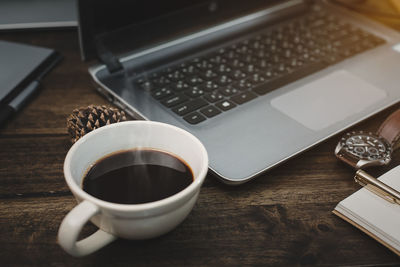 High angle view of coffee cup on table