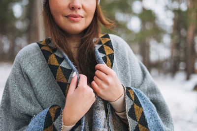 Portrait of a beautiful young woman in winter