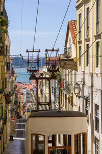 Bright sunny street in the old center of lisbon with funicular. portugal