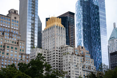 Low angle view of buildings against sky in city