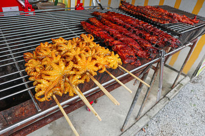 High angle view of meat on barbecue grill