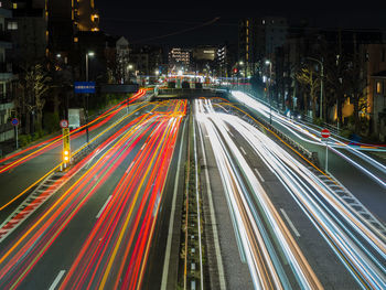 High angle view of light trails on highway at night