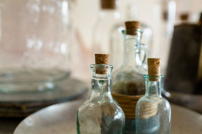 Close-up of wine bottles on table