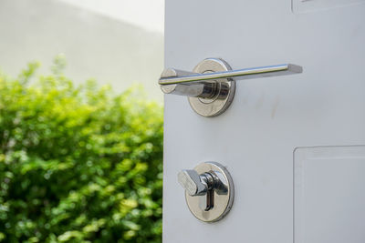 Close-up of clock on door