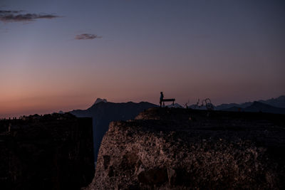 Scenic view of silhouette mountain against sky during sunset