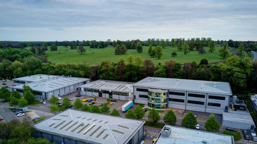 High angle view of buildings and trees against sky