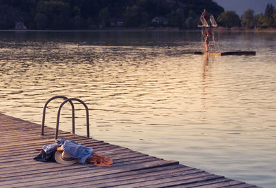 Bathing scene at the edge of lake barterand in the ain in the evening