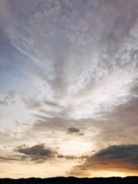 Low angle view of cloudy sky during sunset