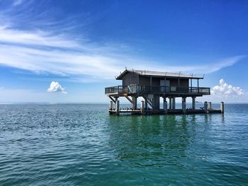 Scenic view of boathouse in sea