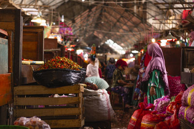 People for sale at market stall