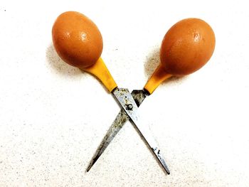 Close-up of eggs against white background