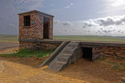 Old ruin building against cloudy sky