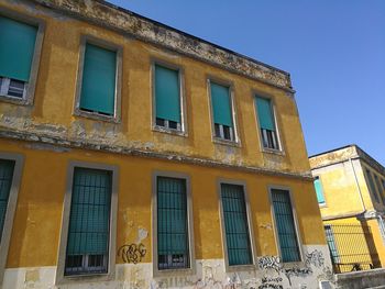 Low angle view of building against blue sky