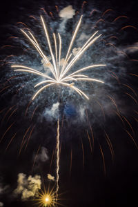 Low angle view of firework display at night