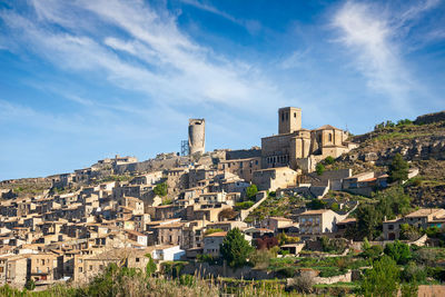 Buildings in city against sky