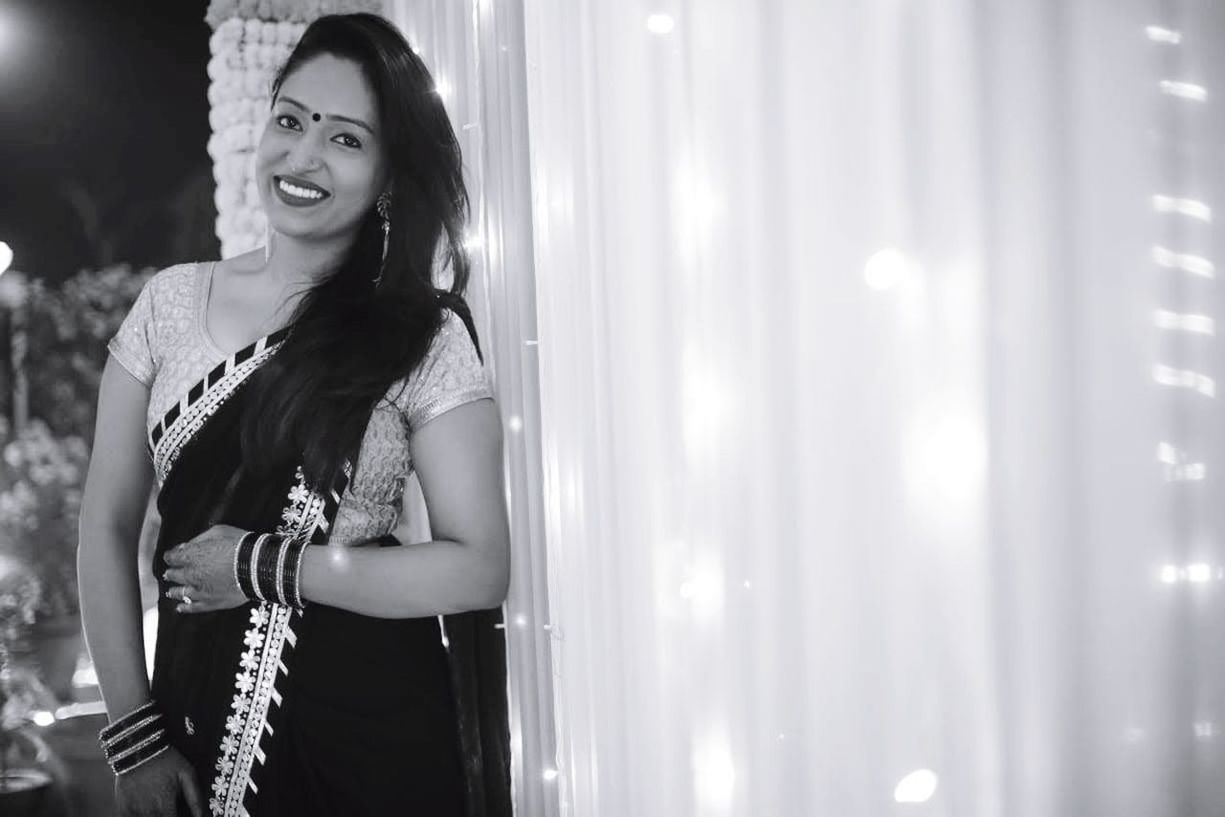 black, white, one person, smiling, adult, women, happiness, young adult, emotion, black and white, fashion, night, arts culture and entertainment, standing, waist up, dress, cheerful, portrait, clothing, lifestyles, monochrome photography, indoors, person, female, enjoyment, illuminated, hairstyle, monochrome, looking, photo shoot, music, three quarter length, long hair, human face, casual clothing, teeth, smile