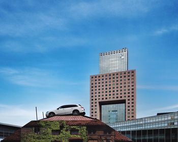 Low angle view of buildings against blue sky