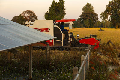 Tractor on field against sky