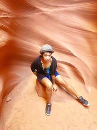 Portrait of smiling young woman in desert