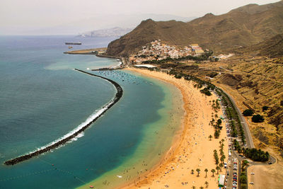 High angle view of sea shore against sky