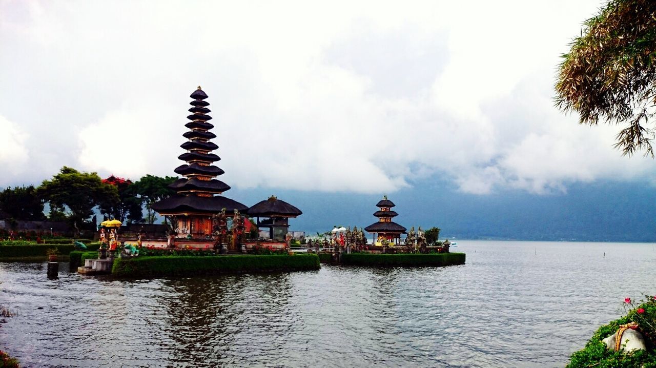 sky, built structure, architecture, religion, tree, building exterior, water, place of worship, spirituality, temple - building, sea, cloud - sky, tranquility, gazebo, waterfront, tranquil scene, nature, scenics, cloud