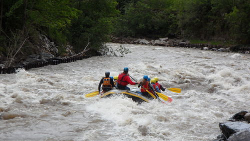 People rafting in river