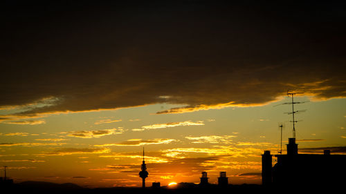 Silhouette of landscape against dramatic sky