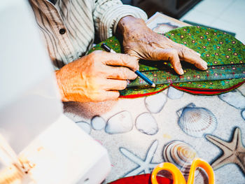 Midsection of woman working in workshop