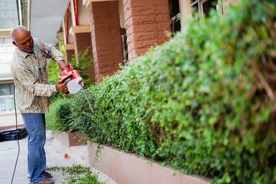 Man holding plants