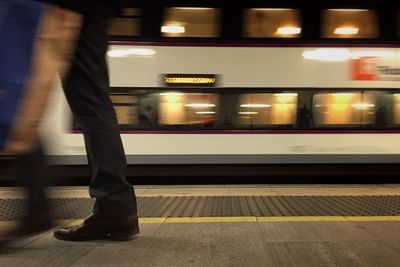 Train moving on railroad station platform