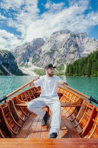 Portrait of woman sitting on boat in sea