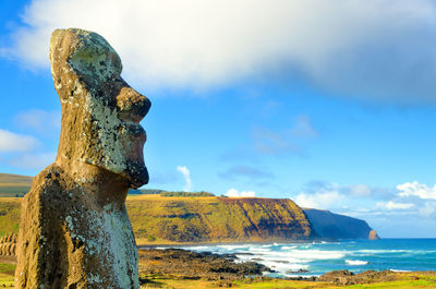 Ancient statue against sky